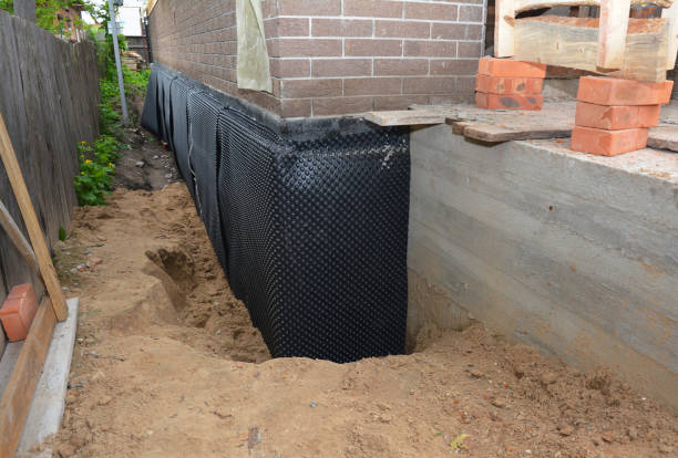 Happy homeowners after waterproofing job in Davisburg